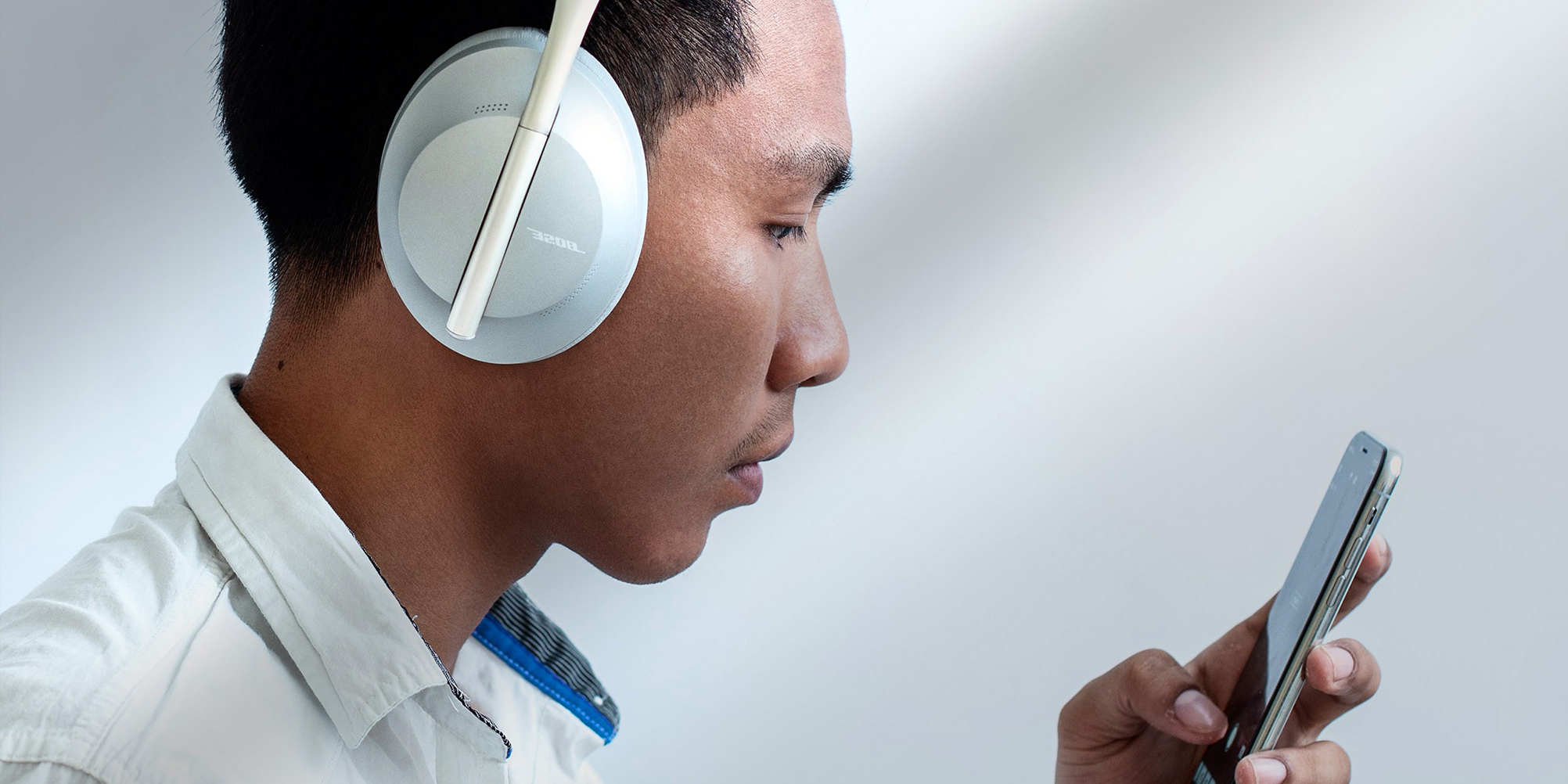 Listen Man listening to music on his smartphone