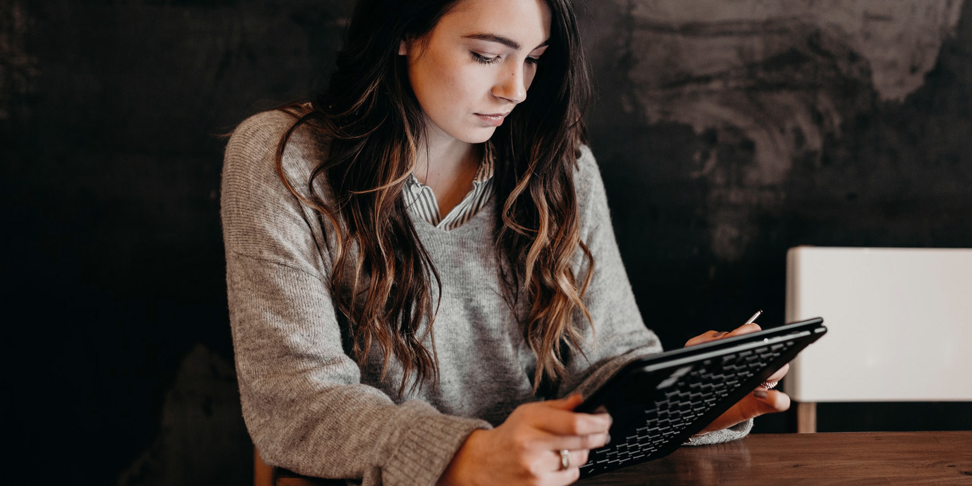 Woman reading a tablet