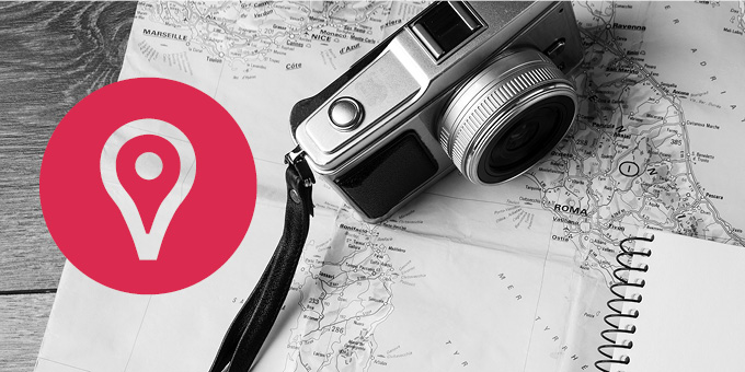 Explore with your VPL card Black and white photo of a camera atop a map