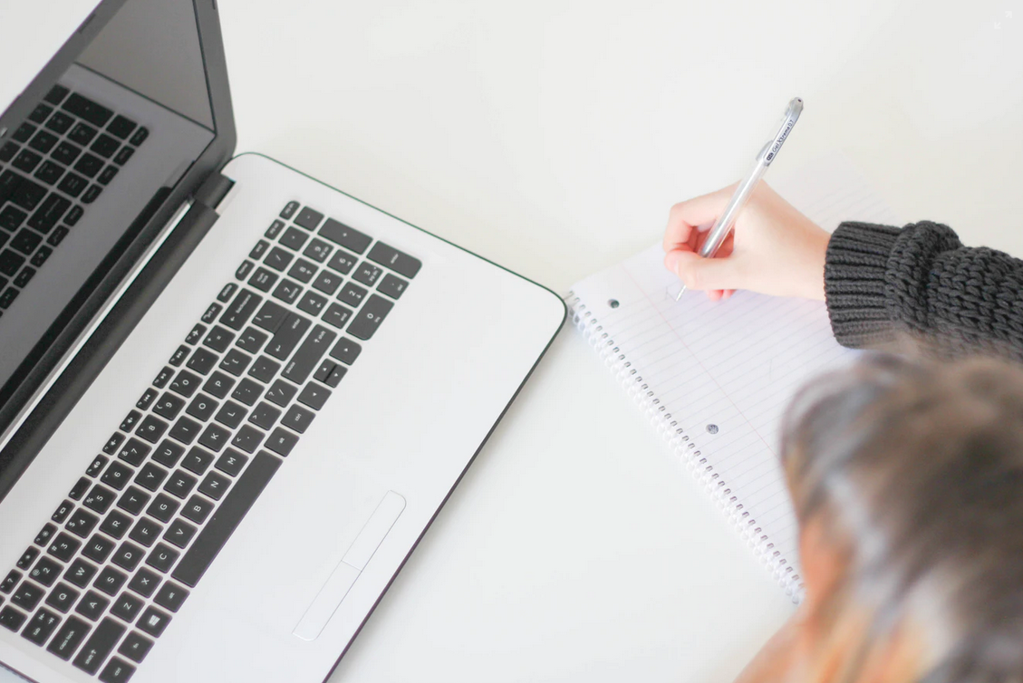 Birds eye view of person working at a laptop