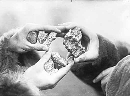 People with gold nuggets in hand, Yukon Territory. People with gold nuggets in hand, Yukon Territory.