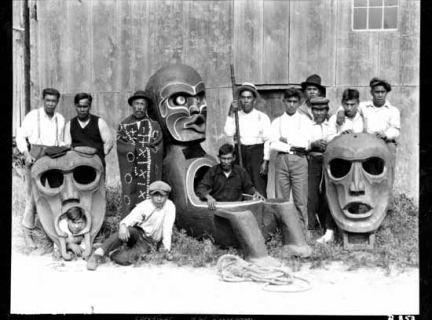 Kwakwaka'wakw men with potlatch bowls, masks, talking stick and button blanket at Alert Bay, VPL #1709, 1926, Albert Paull"