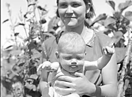 black and white historical photo, Woman with baby