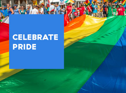 Celebrate Pride with VPL! A photo of a large pride flag being carried down the middle of the street by parade participants at the Vancouver Pride parade. A blue box with white text to the left of the image reads: CELEBRATE PRIDE
